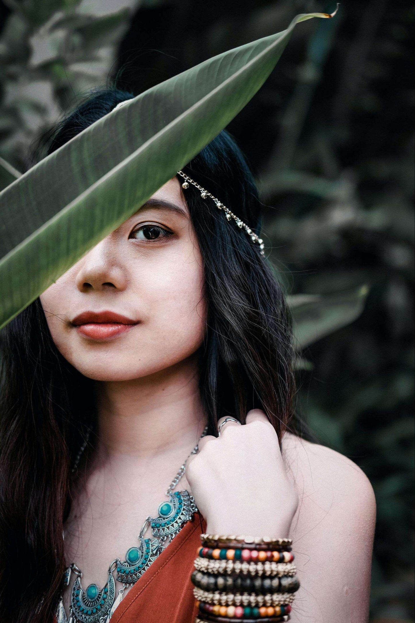 a model wears handmade horn earrings jewelry