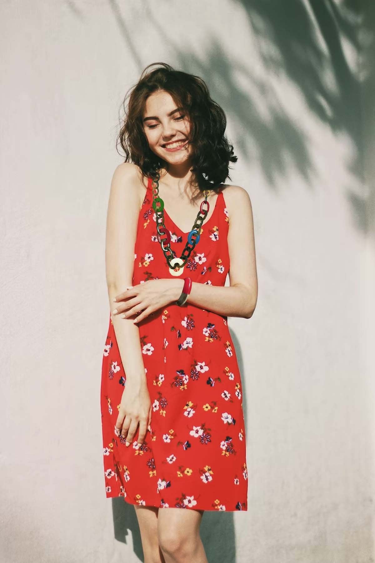 a model girl wears bright unique necklace that is made of natural buffalo horn