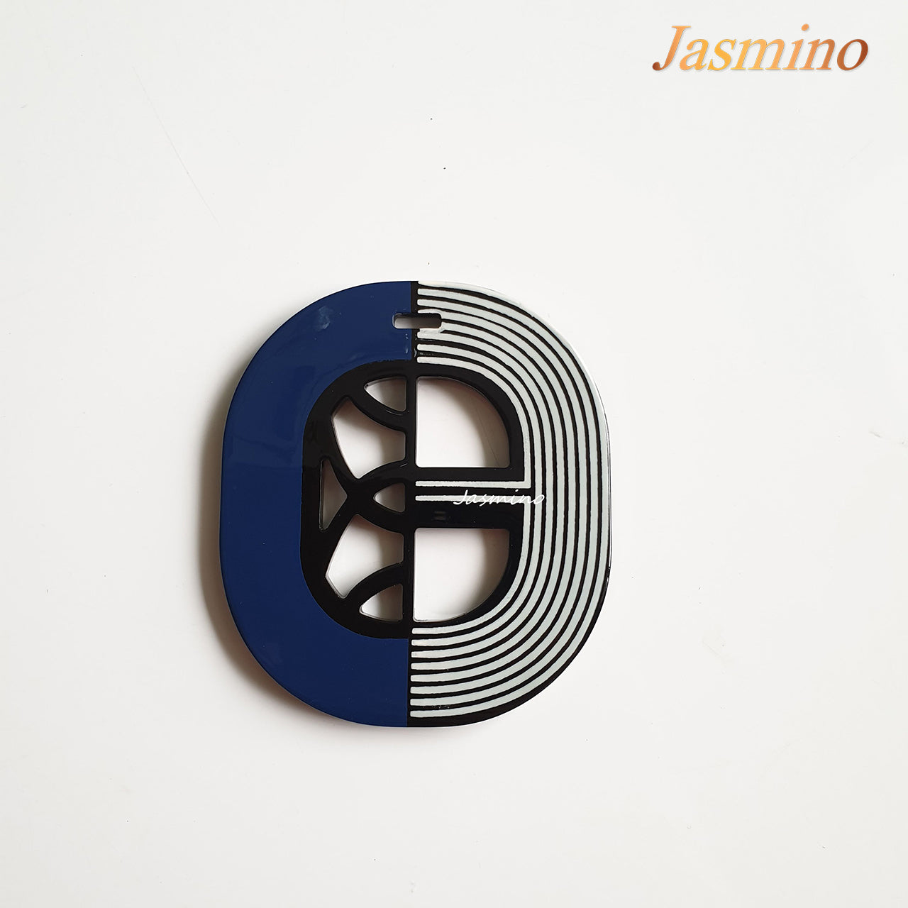 elliptical navy blue lacquer pendant on the light background, impressive gift for her