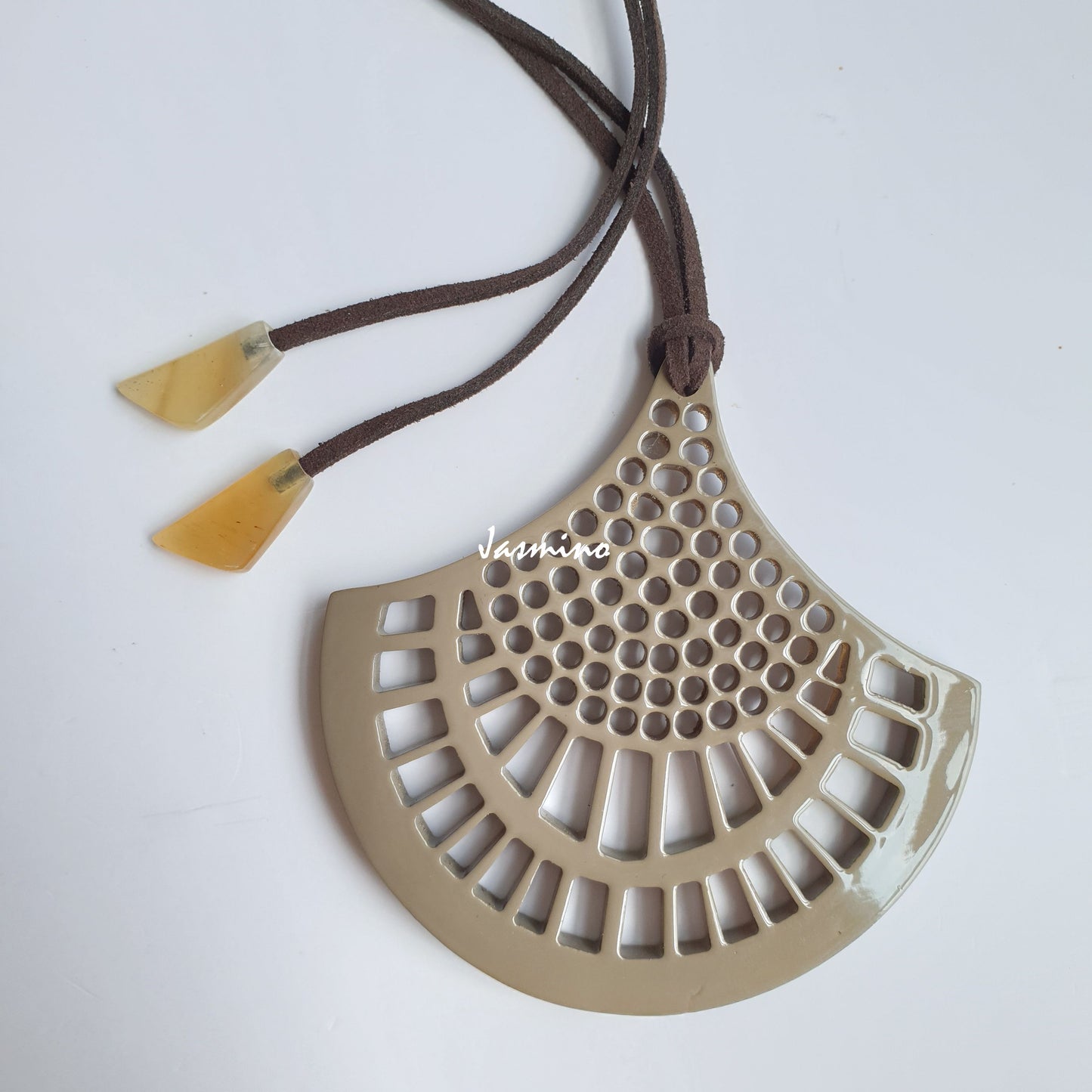 Vintage unique handmade pendant features a beige colour made of natural buffalo horn for women