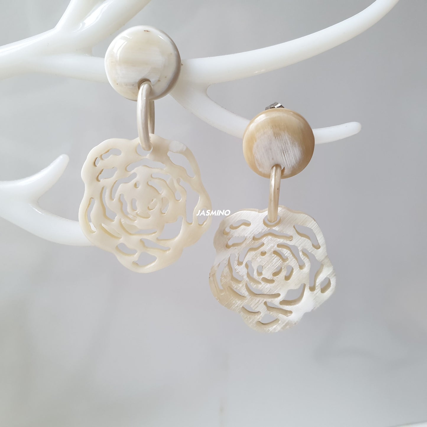 handmade drop earrings feature white and floral shape in natural buffalo horn for Spring 2023