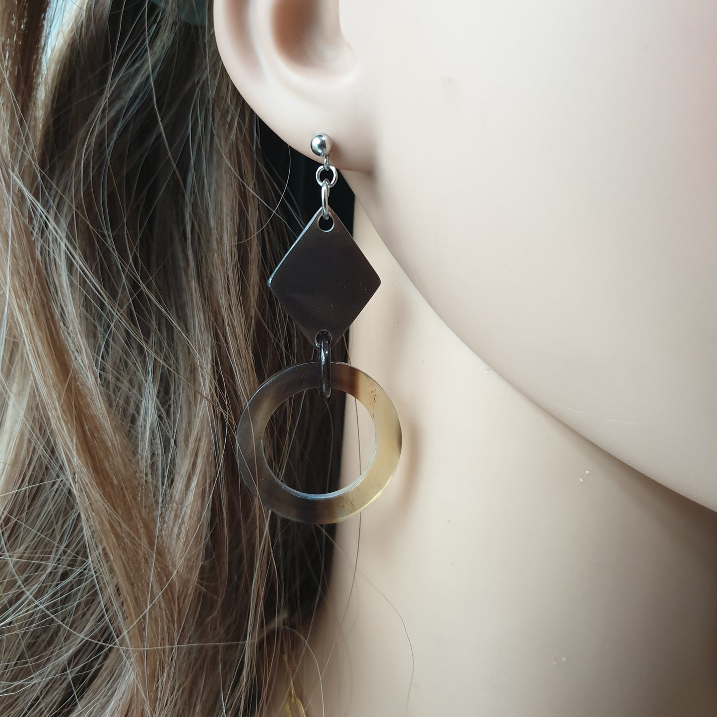 handmade earrings feature black and brown in the shape of circle and rhombus in natural buffalo horn for Spring 2023
