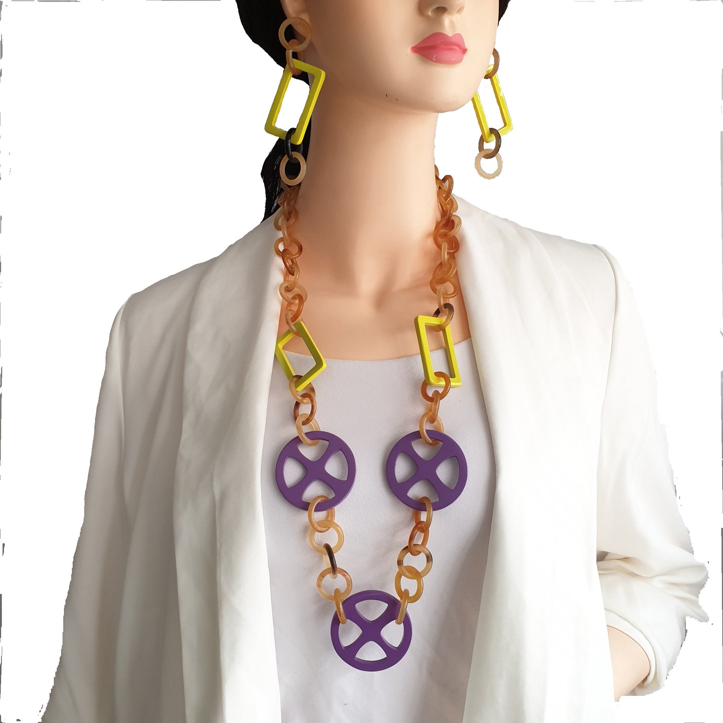 a model wears horn rectangular chain link drop earrings