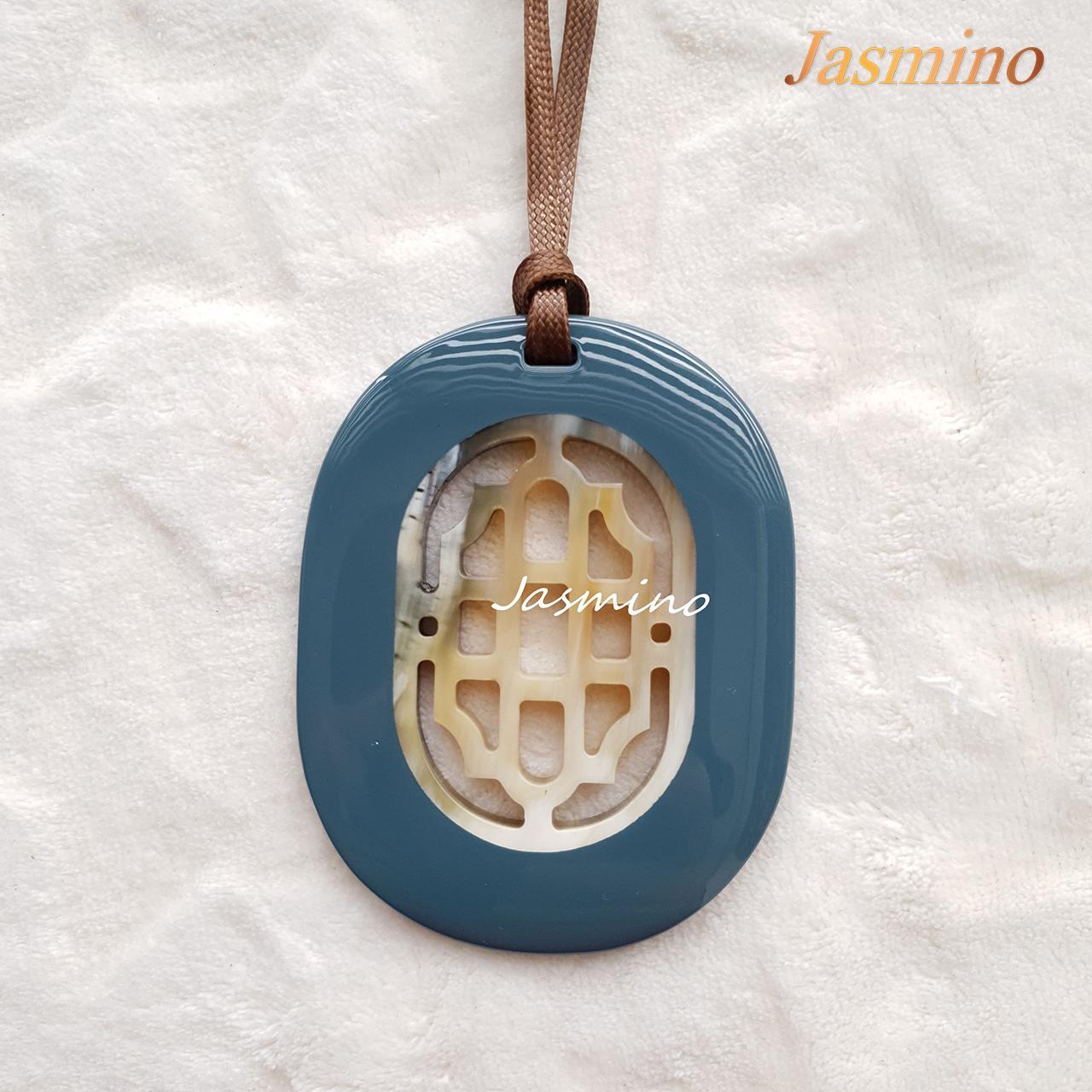 elliptical denim lacquer horn pendant with a unique pattern in natural light, impressive gift for her