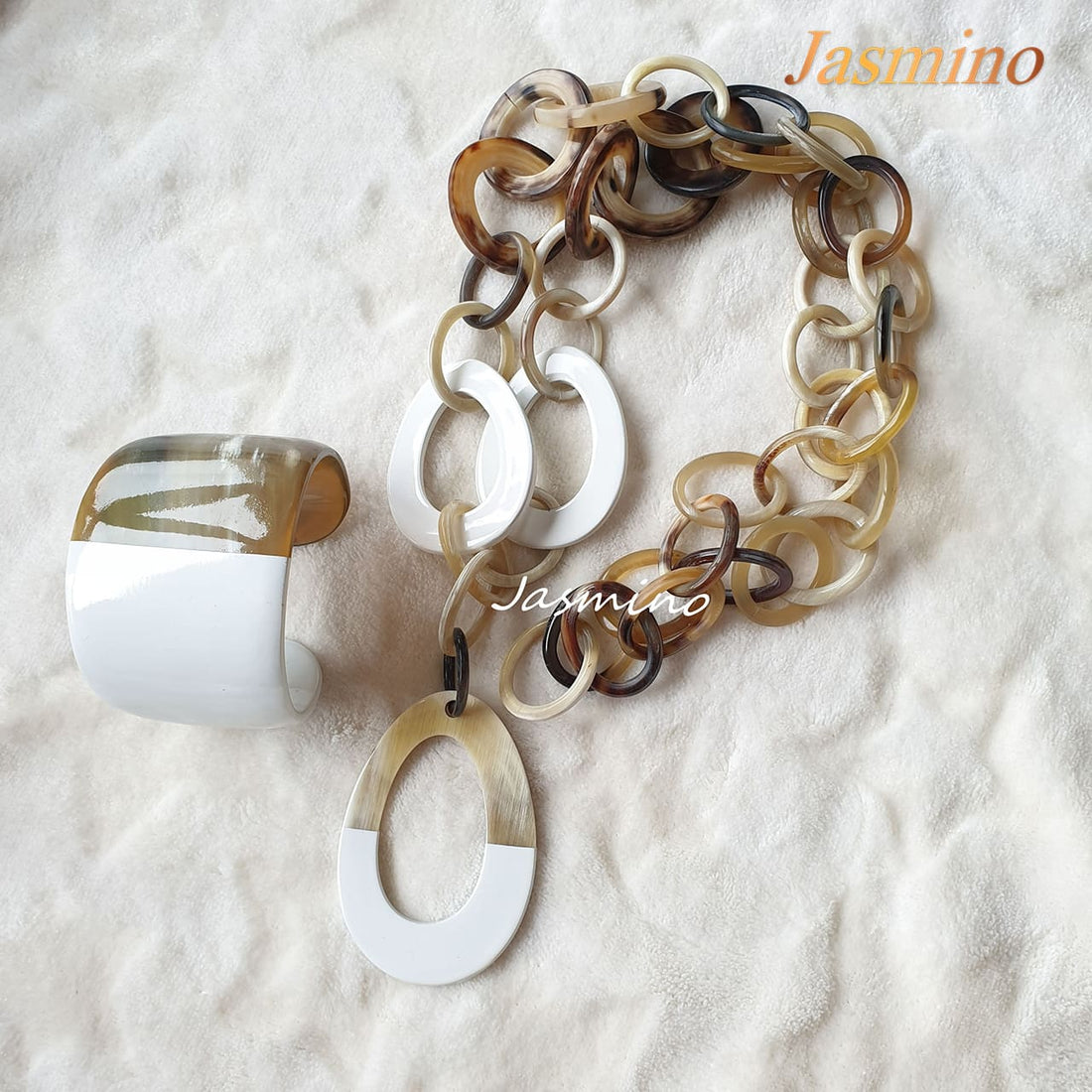 white horn necklace and cuff bracelet