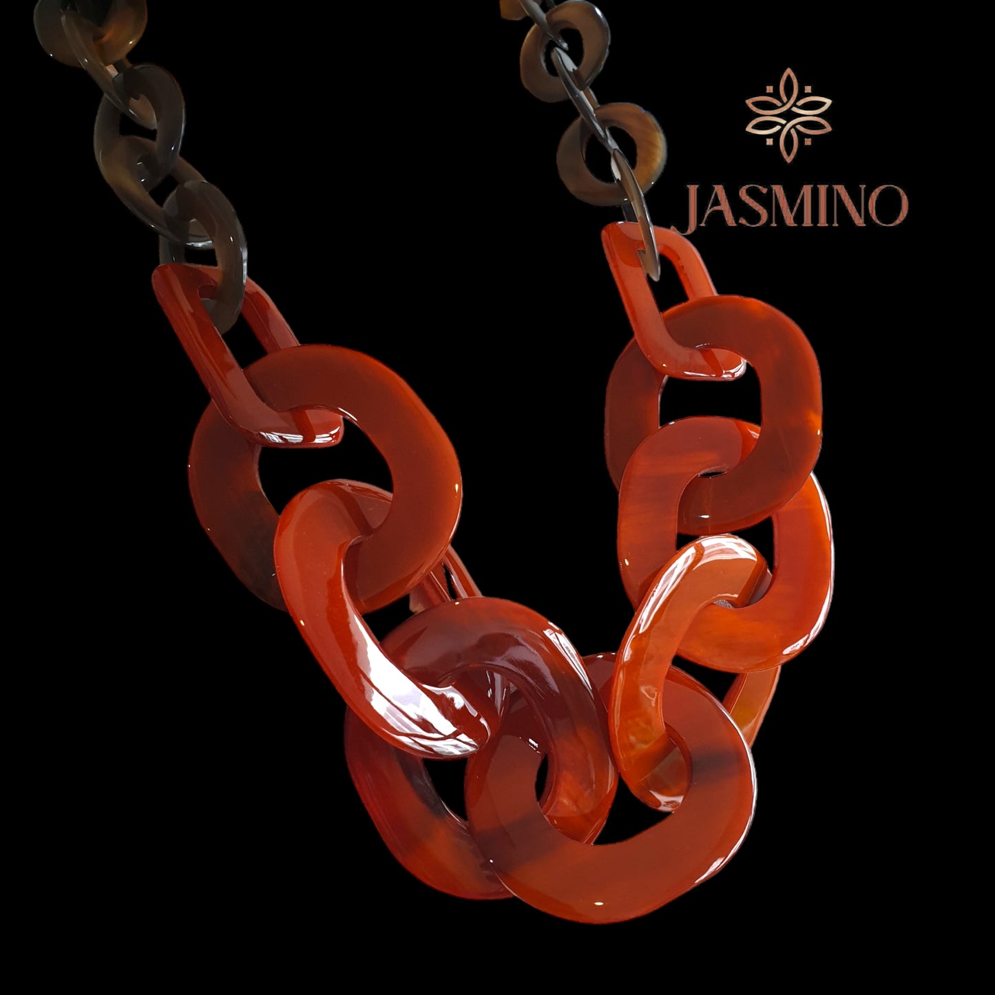 large chain link necklace features orange in natural buffalo horn for Spring on blackground
