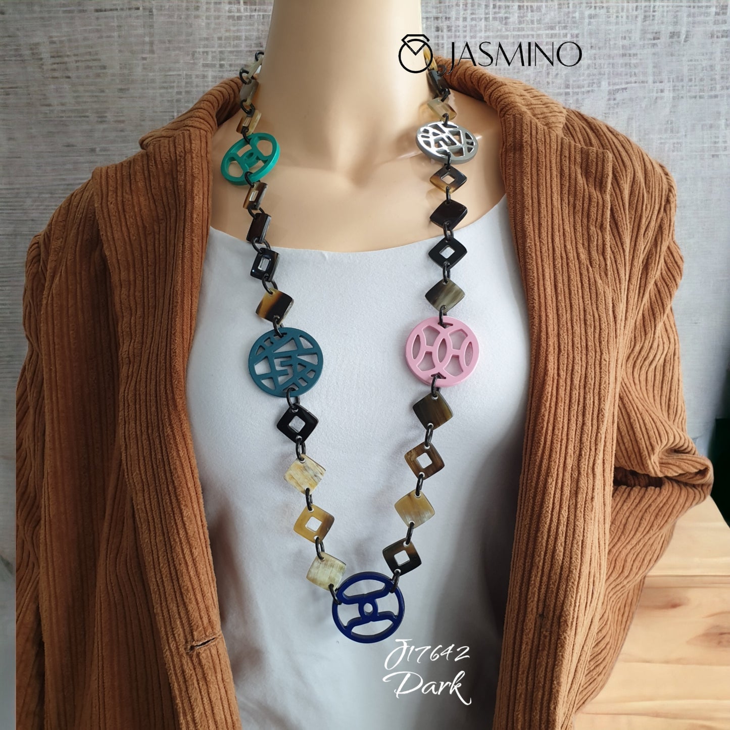 A model is wearing unique handmade Bohemian chain link diamond shaped chain link necklace jewelry in natural buffalo horn