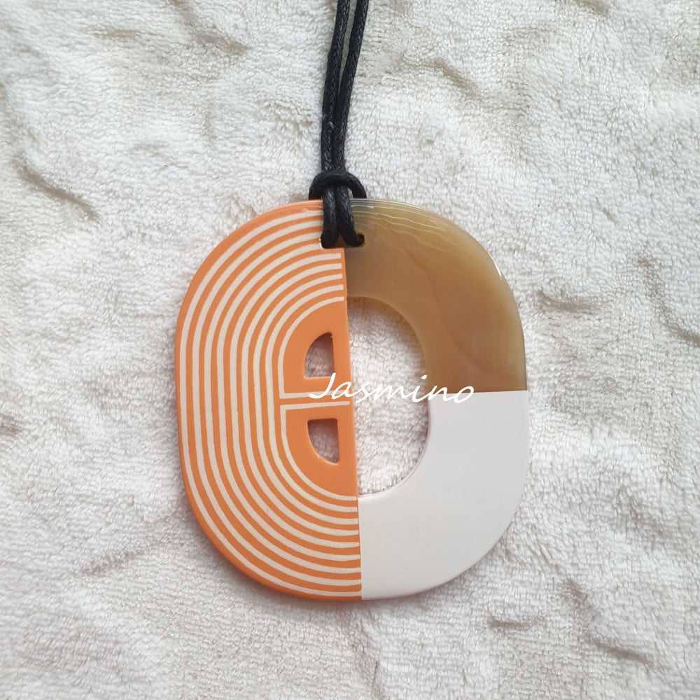 
                  
                    Jasmino Autumn Unique Two-Faced Orange Pendant Necklace Made By Natural Buffalo Horn
                  
                