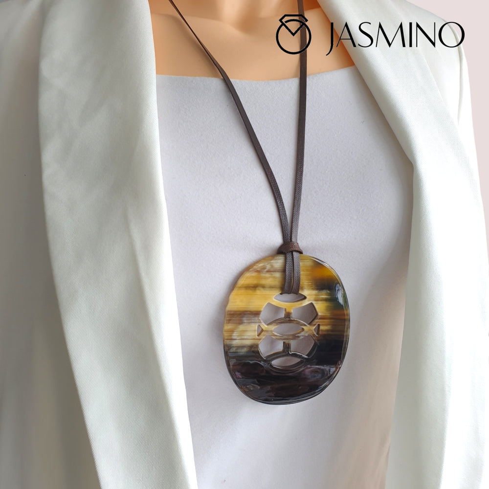
                  
                    natural horn pendant with unique pattern on the model, impressive gift for her
                  
                