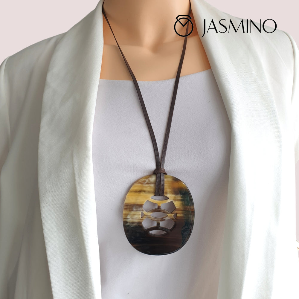 
                  
                    natural horn pendant with unique pattern on the model, impressive gift for her
                  
                
