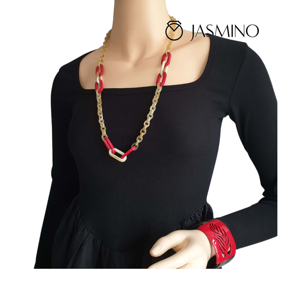 
                  
                    a model is wearing a Red leaf cuff bracelet made from natural buffalo horn
                  
                