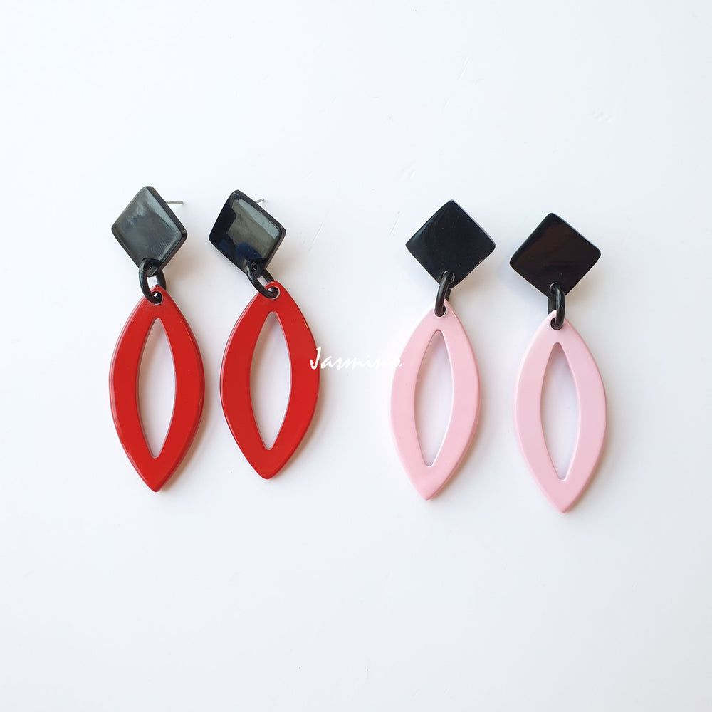 
                  
                    Two pairs of unique handmade oval earrings feature a leaf shape made of natural buffalo horn
                  
                