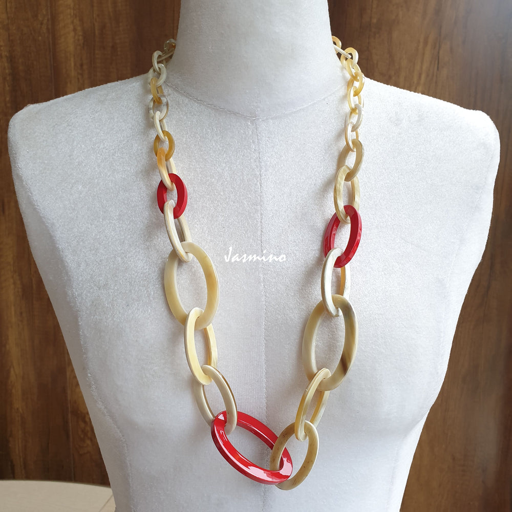 
                  
                    The necklace has several red pieces in natural light, impressive gift for her
                  
                