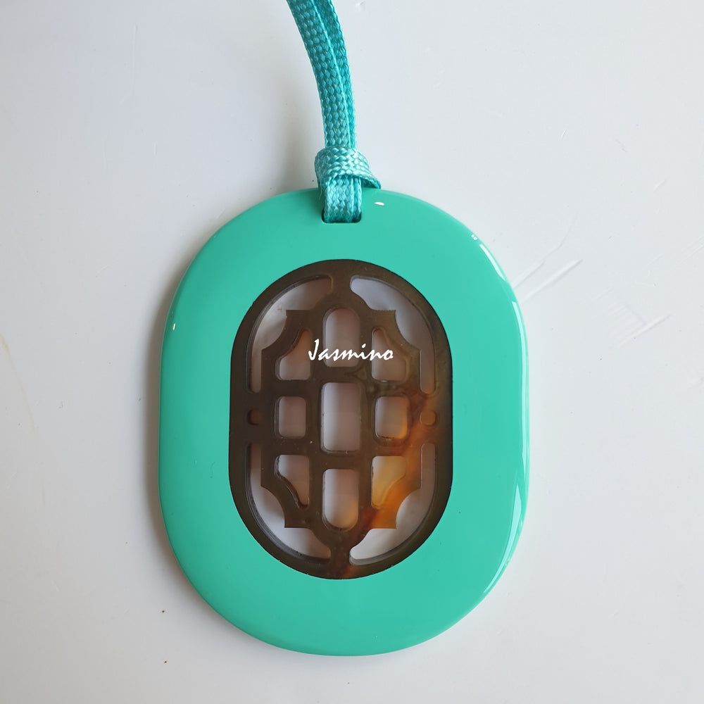 
                  
                    elliptical turquoise lacquer horn pendant with a unique pattern in natural light, impressive gift for her
                  
                