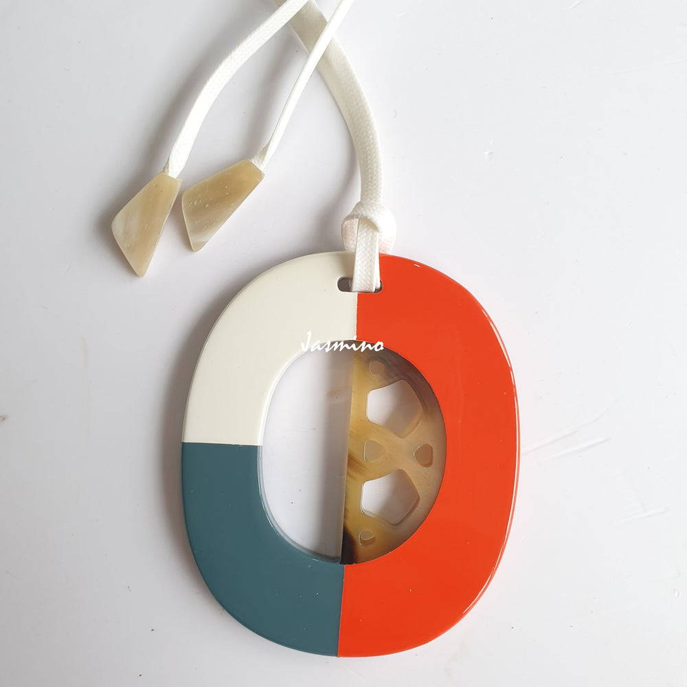 
                  
                    trendy buffalo horn pendant is painted in three colors: blue grey, orange-red and brilliant white in natural light, an impressive gift for her
                  
                