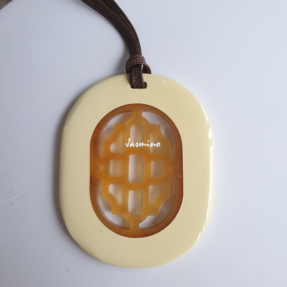 
                  
                    elliptical beige lacquer horn pendant with a unique pattern in natural light, impressive gift for her
                  
                
