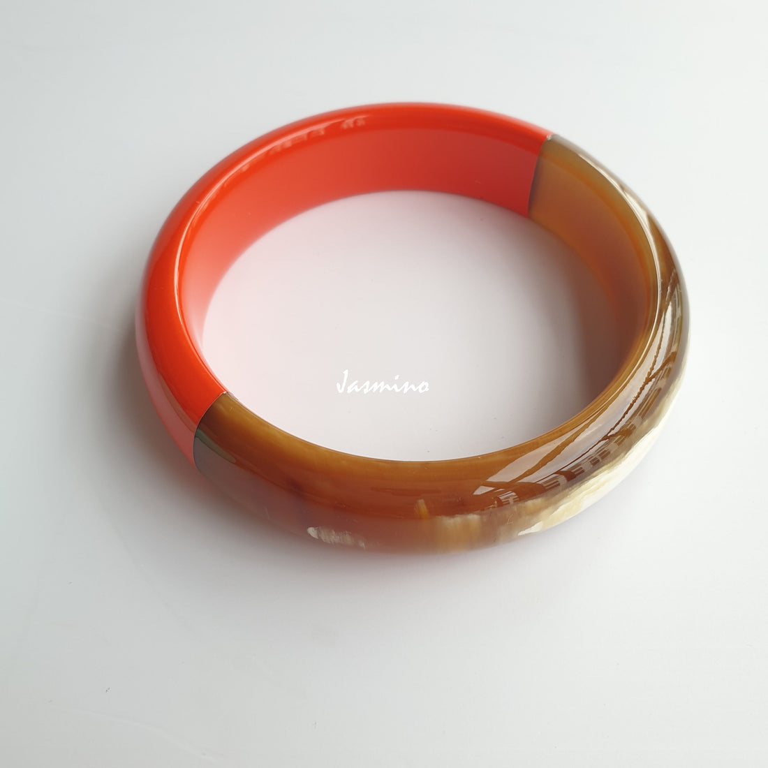 unique handmade Vintage thin bangle bracelet features a brown half and an orange half made of natural buffalo horn for women on Thanksgiving