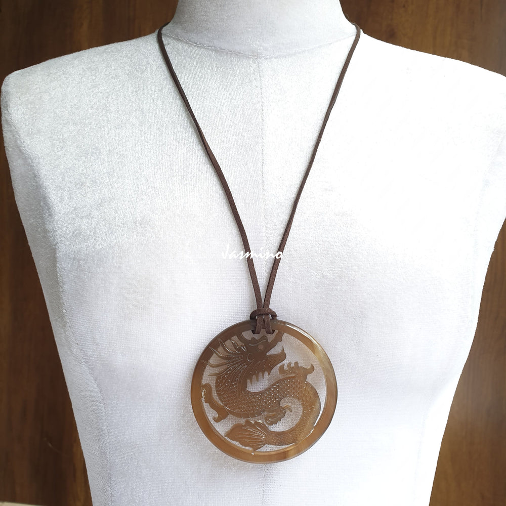 
                  
                    Jasmino antique Asian dragon oval brown pendant in natural buffalo horn for men and women
                  
                