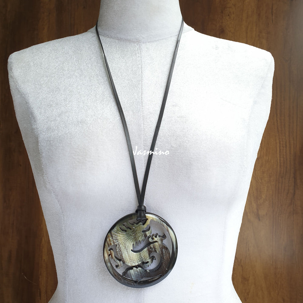 
                  
                    Jasmino antique Asian dragon oval grey pendant in natural buffalo horn for men and women
                  
                