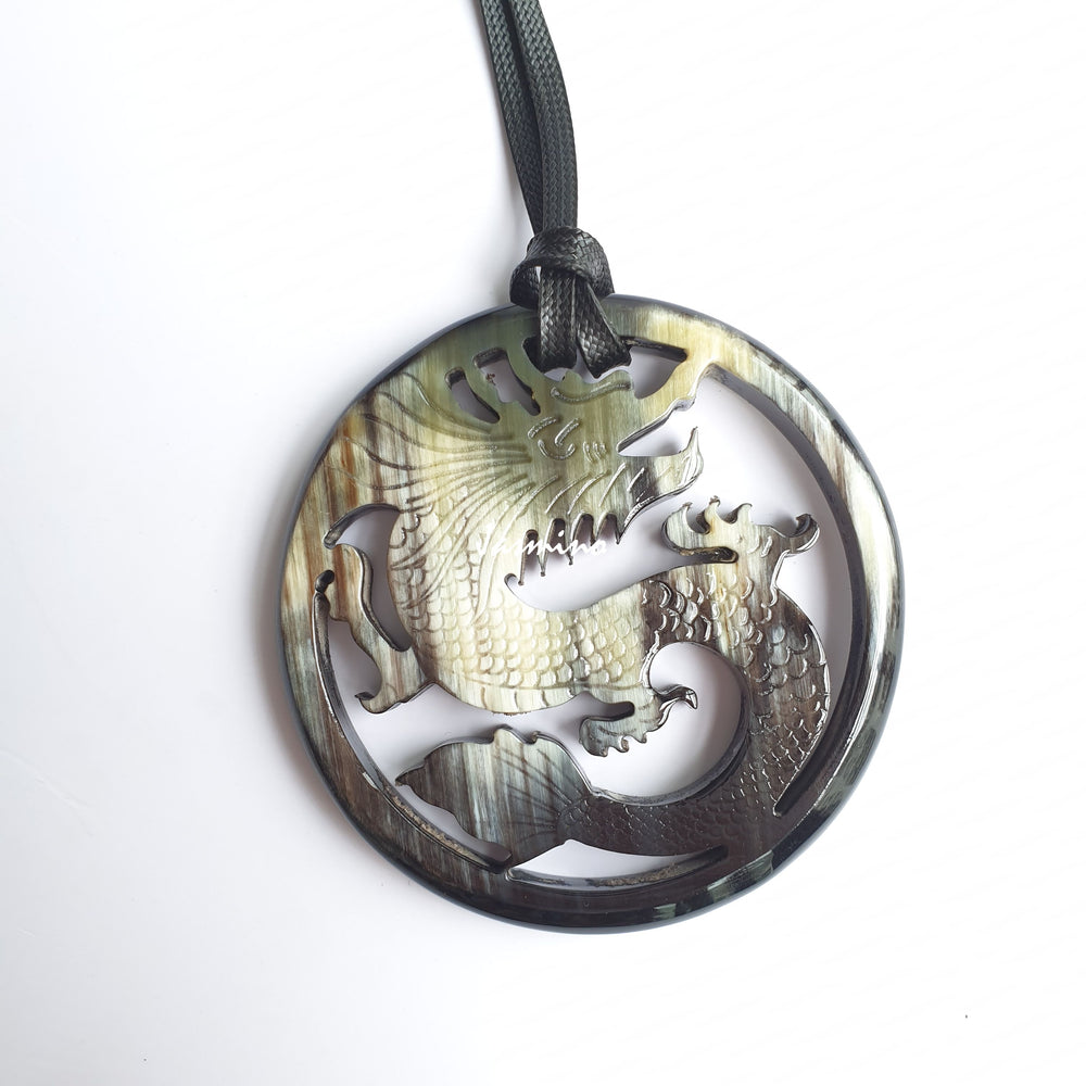 
                  
                    Jasmino antique Asian dragon oval grey pendant in natural buffalo horn for men and women
                  
                
