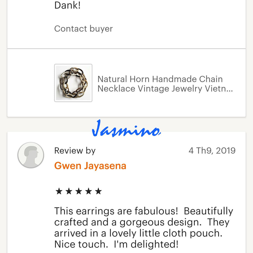 
                  
                    Two customers give good reviews to a jewelry collection in a handmade shop
                  
                