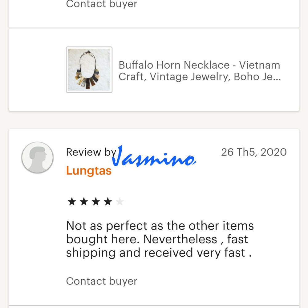 Two customers give good reviews to a handmade jewelry collection in a shop