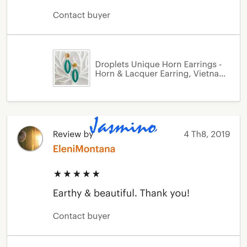 
                  
                    Two customers give good reviews to a jewelry collection in a handmade shop
                  
                