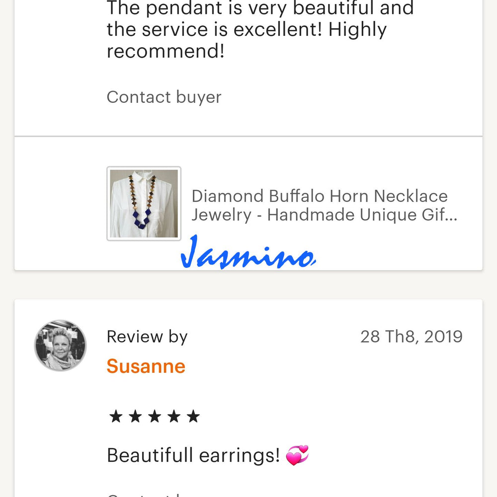 
                  
                    Customers give positive feedback to a handmade jewelry collection in a shop
                  
                