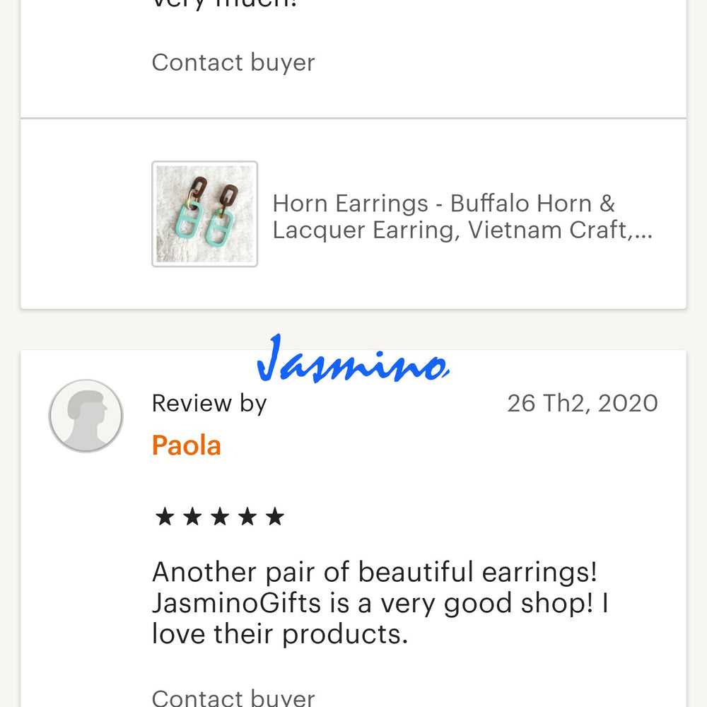 
                  
                    Two customers give positive feedback for a handmade jewelry collection in a shop
                  
                