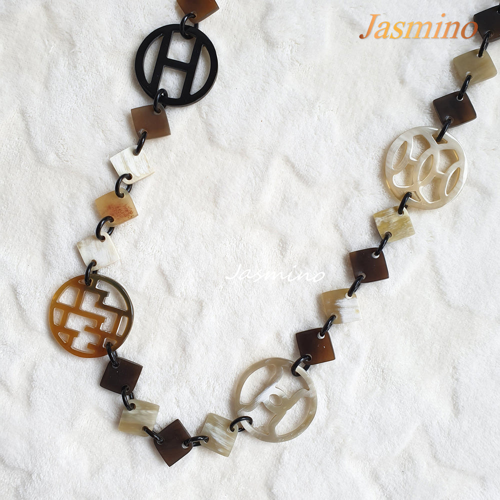 
                  
                    this necklace is made of lozenge buffalo horn pieces combined with unique circle horn pieces, is an impressive gift for your friend
                  
                