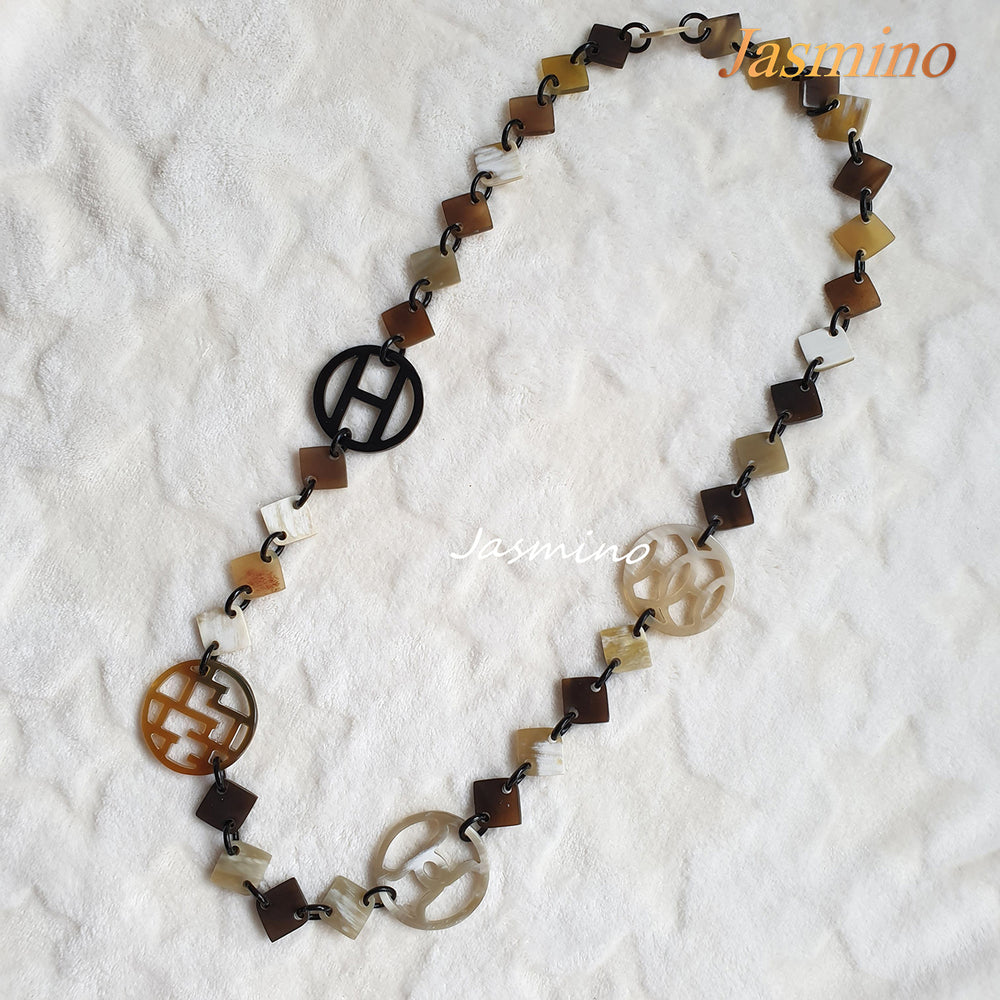 
                  
                    this necklace is made of lozenge buffalo horn pieces combined with unique circle horn pieces, is an impressive gift for your friend
                  
                