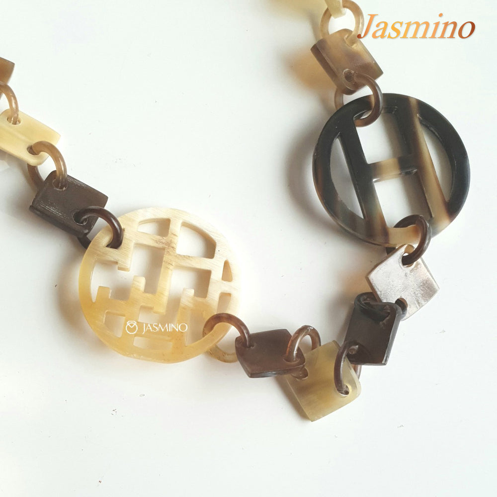 
                  
                    this necklace is made of lozenge buffalo horn pieces combined with unique circle horn pieces, is an impressive gift for your friend
                  
                