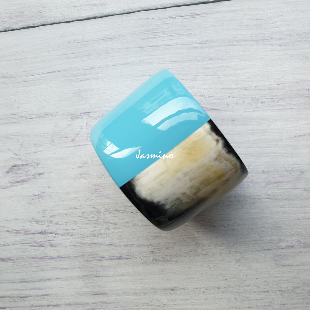 
                  
                    Jasmino unique handmade bangle bracelet features a sky blue half in natural buffalo horn for women on Christmas and Thanksgiving
                  
                