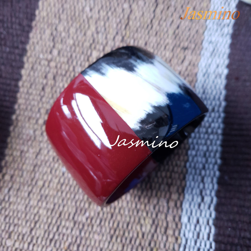 
                  
                    Jasmino unique handmade Ethnic Vintage bangle bracelet features a red half in natural buffalo horn
                  
                