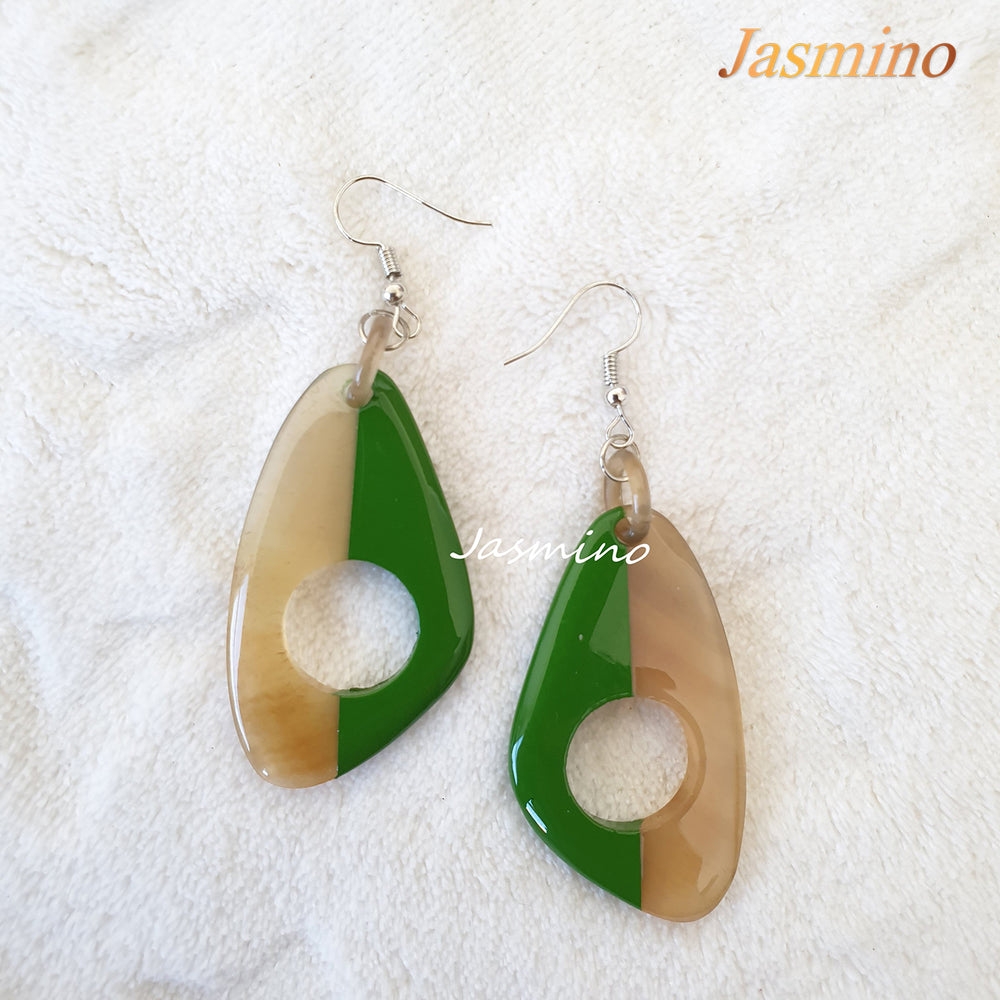 
                  
                    Unique handmade butterfly earrings with half natural horn and half painted green on the light background, impressive gift for her
                  
                