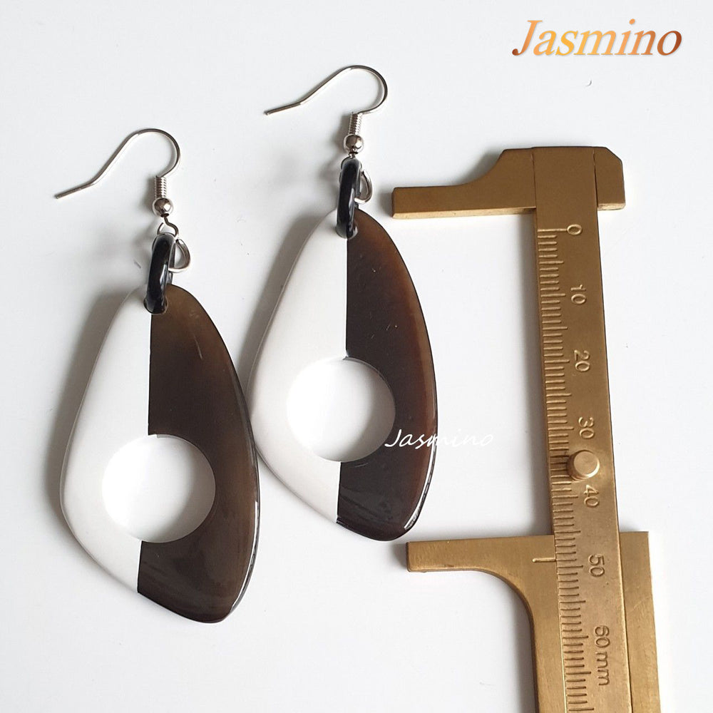 
                  
                    Unique handmade earrings with half natural horn and half painted bright white on the light background- 5cm, impressive gift for her
                  
                