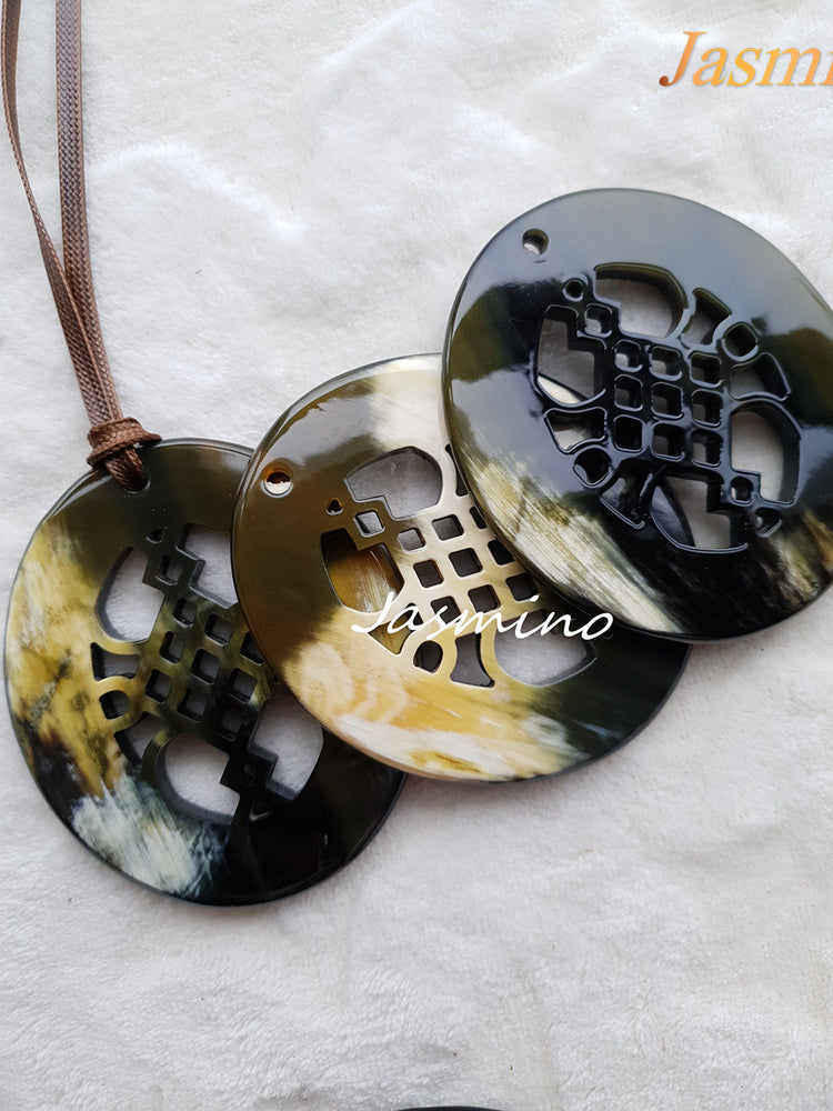 
                  
                    Three unique handmade Vintage pendants feature an oval shape in natural buffalo horn for girls
                  
                