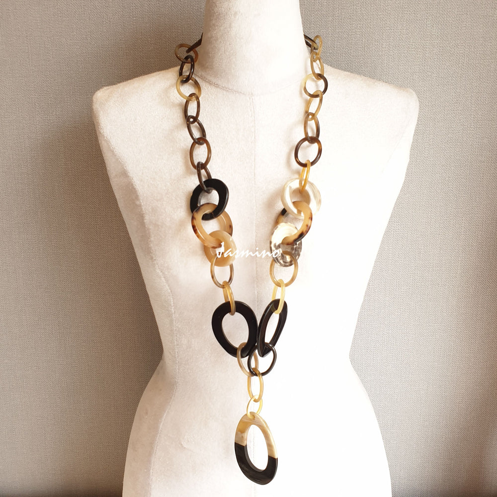 
                  
                    The necklace has some large brilliant white pieces on the light background, a unique gift for her
                  
                