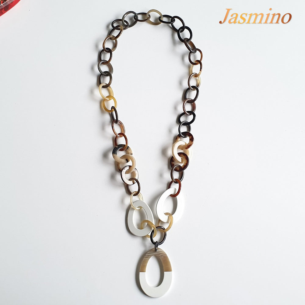 
                  
                    The necklace has some large brilliant white pieces on the light background, a unique gift for her
                  
                