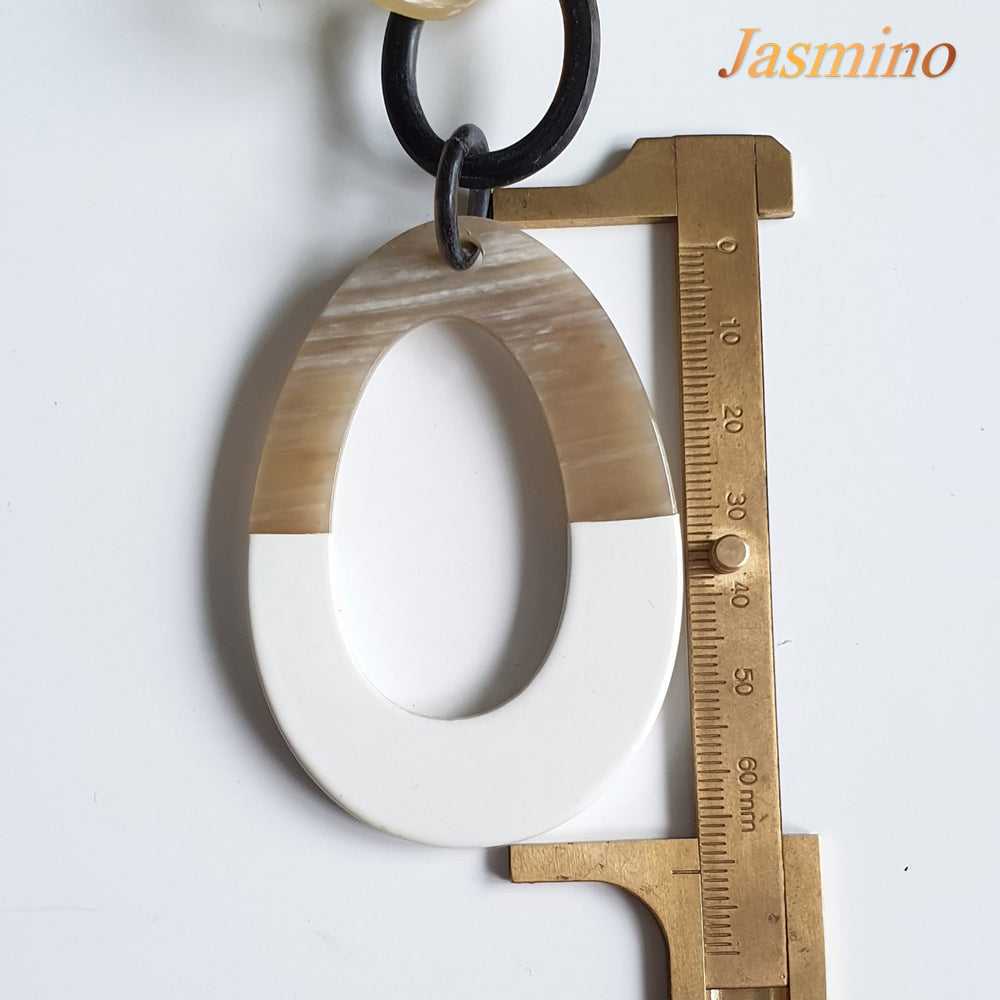 
                  
                    The necklace has some large brilliant white pieces on the light background, a unique gift for her
                  
                