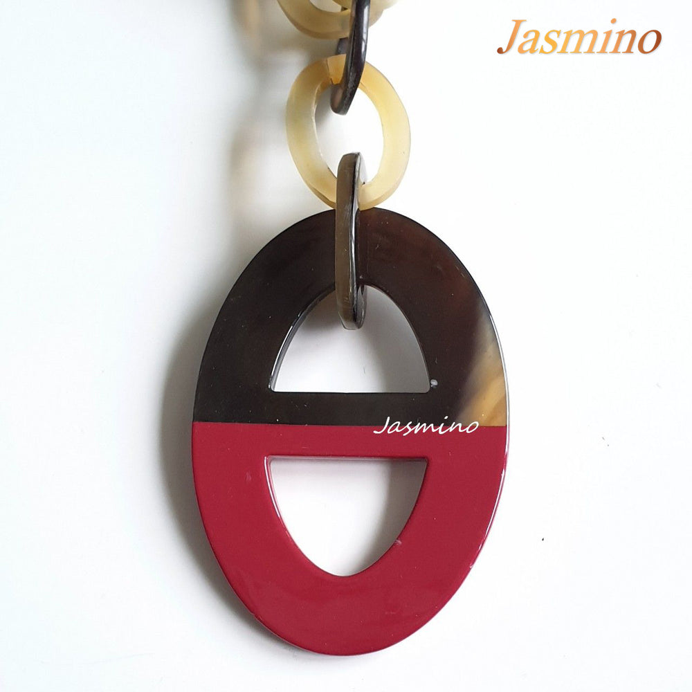 
                  
                    buffalo horn necklace has the largest ellipse with half natural buffalo horn and half painted pink in natural light, an impressive gift for her
                  
                
