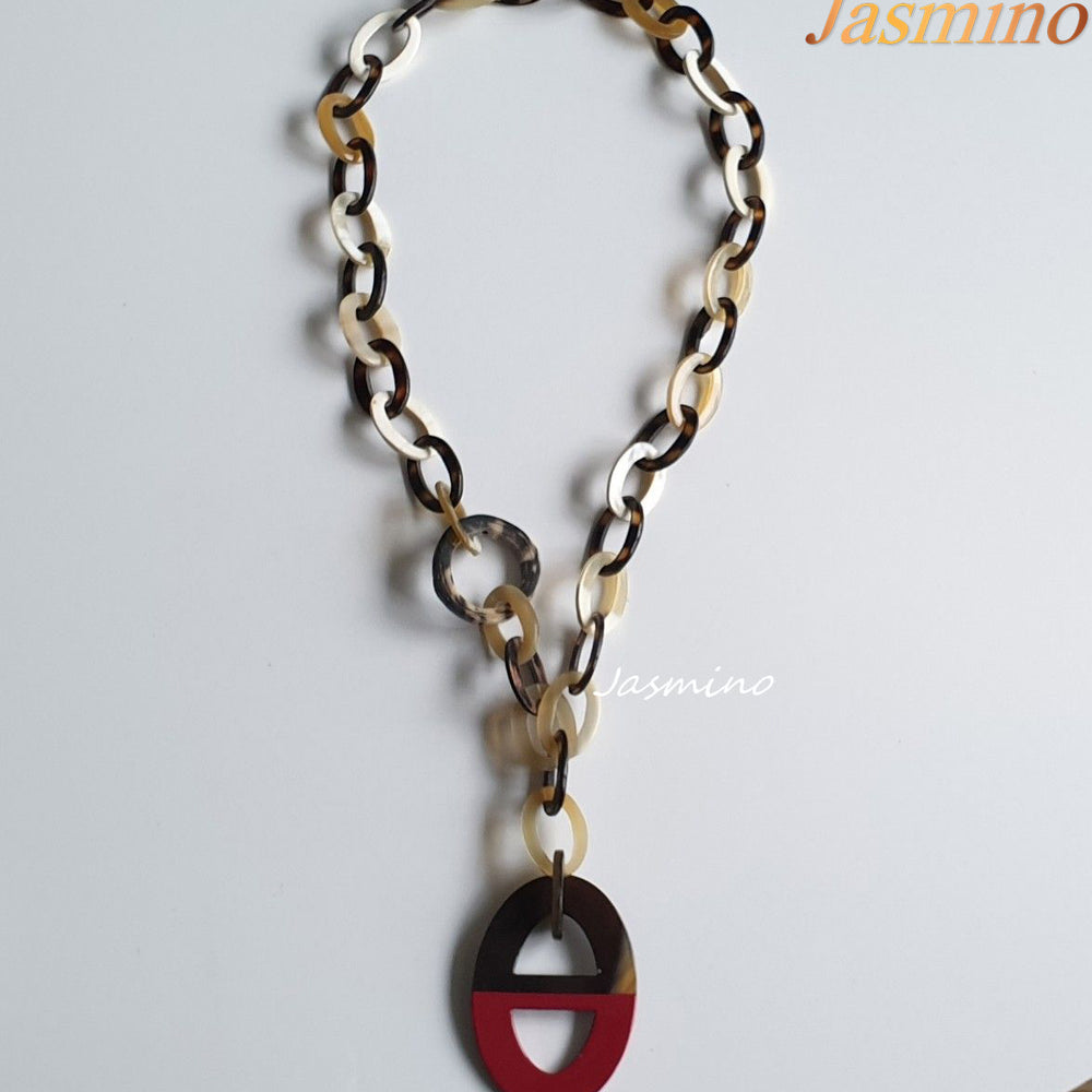 
                  
                    buffalo horn necklace has the largest ellipse with half natural buffalo horn and half painted pink in natural light, an impressive gift for her
                  
                