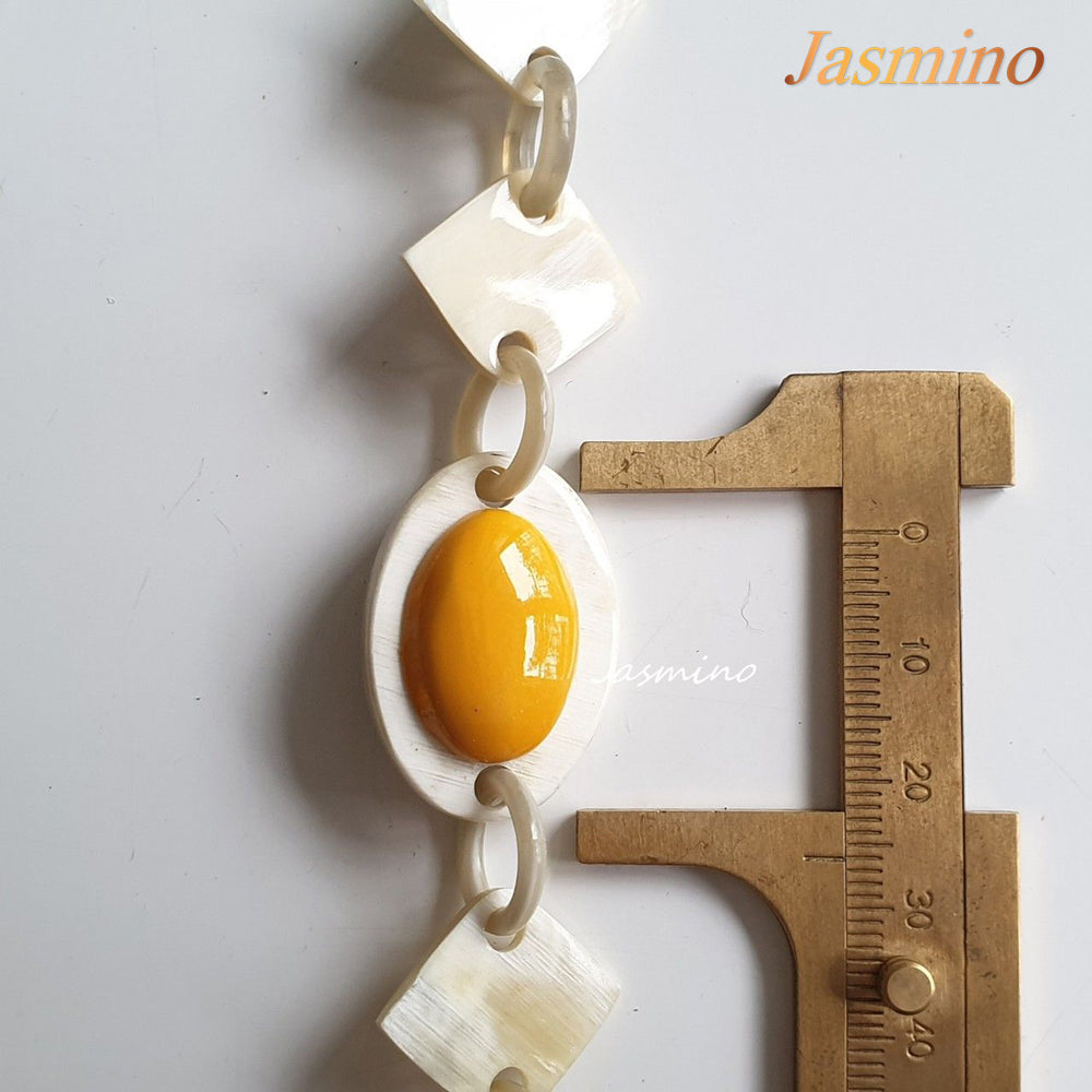 
                  
                    The necklace has several yellow cat-eye links, unique gift for her
                  
                