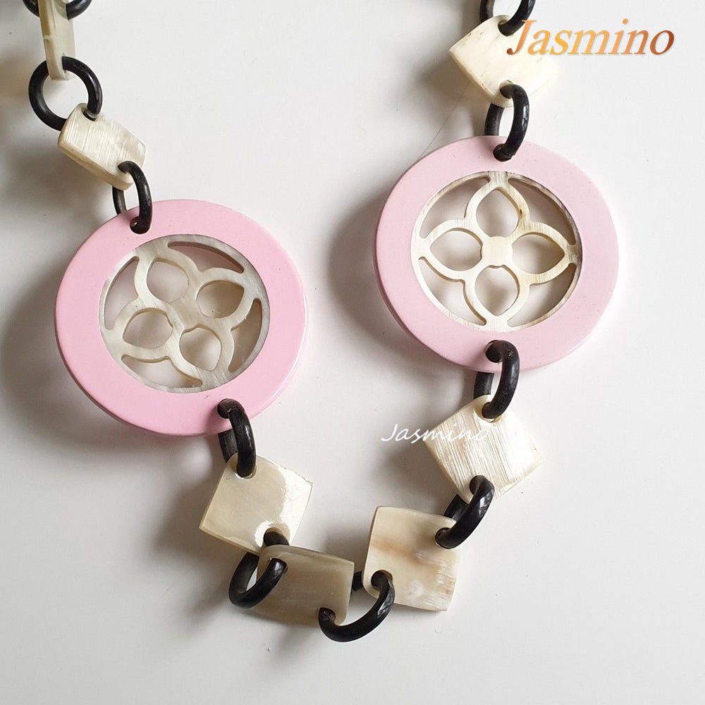 
                  
                    This necklace is made of natural lozenge buffalo horn pieces and four circle pink horn pieces with a unique pattern stands out on a light background, is a unique gift for friends
                  
                