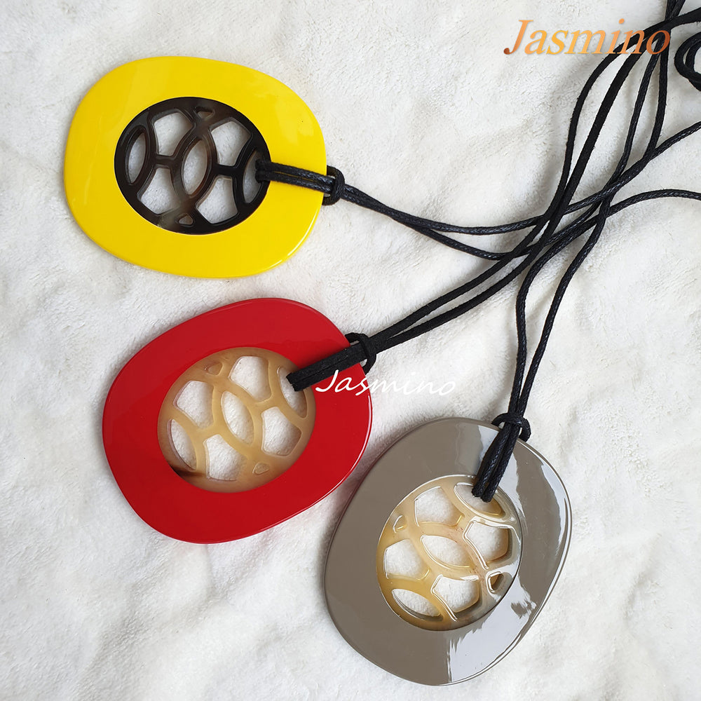 
                  
                    Three unique handmade Vintage oval pendant in natural buffalo horn for women
                  
                