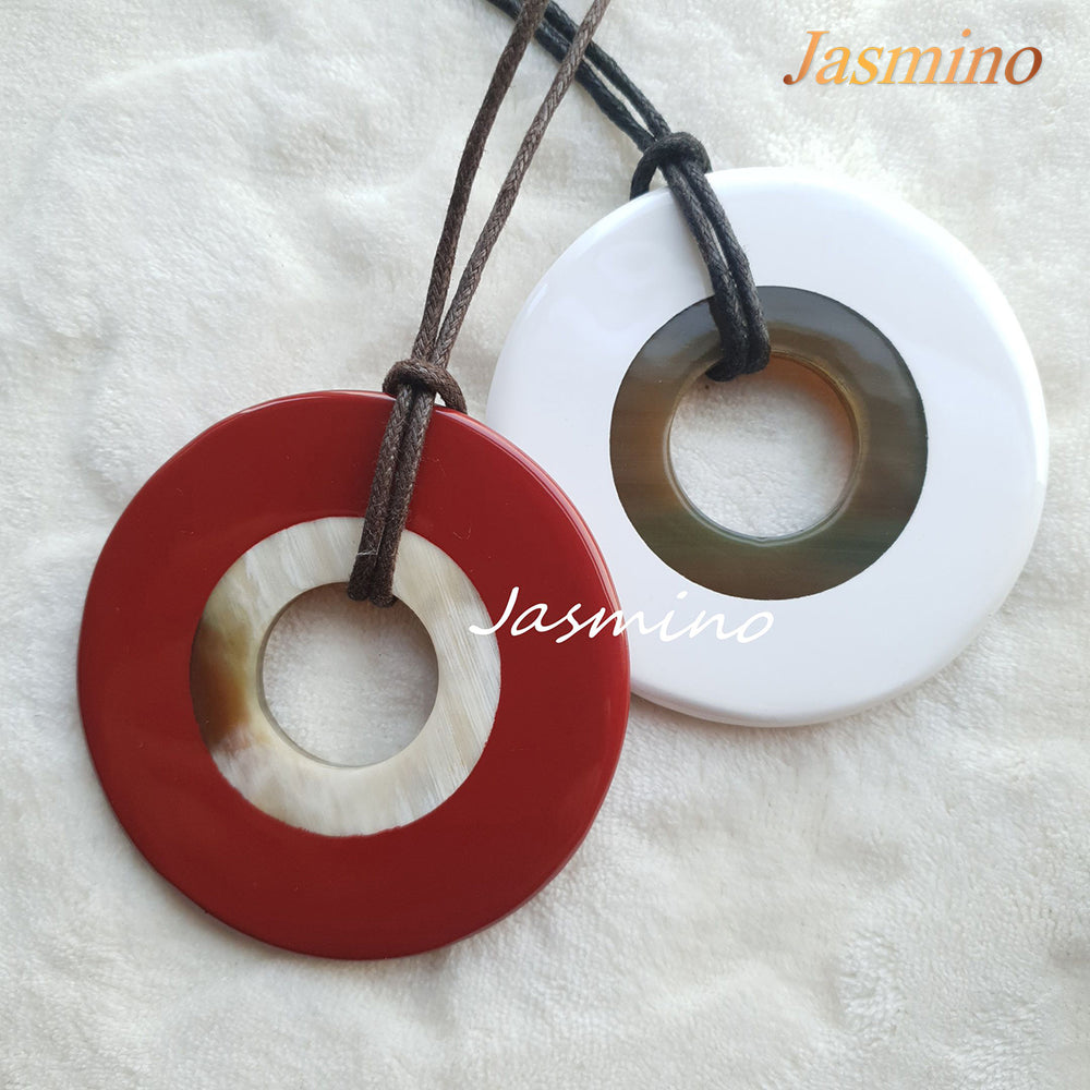 
                  
                    round red dahlia horn pendant on the light background, impressive Christmas gift for her
                  
                