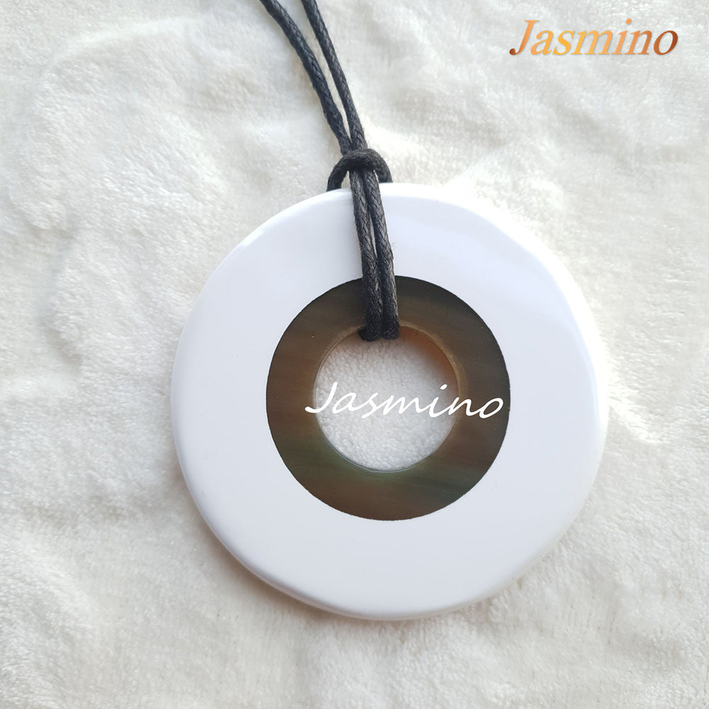 
                  
                    round brilliant white horn pendant on the light background, impressive gift for her
                  
                
