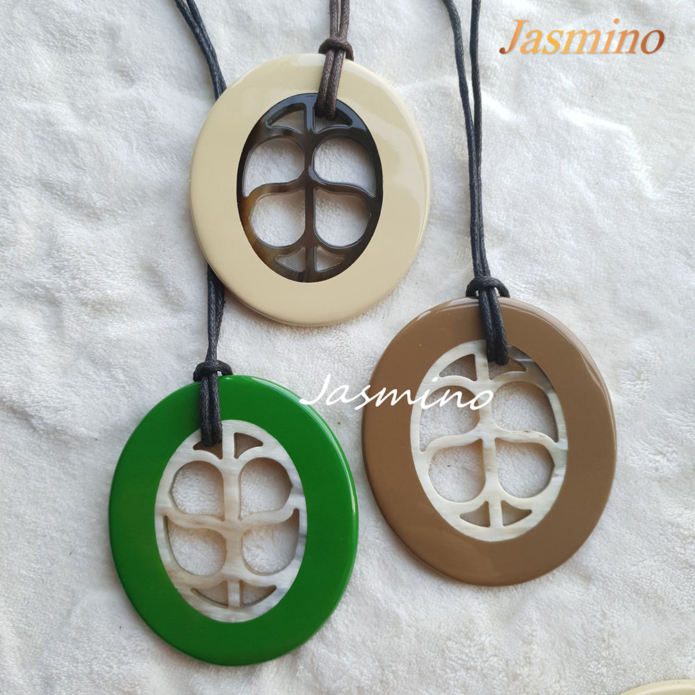 
                  
                    three unique handmade oval pendants are made of natural buffalo horn for women
                  
                