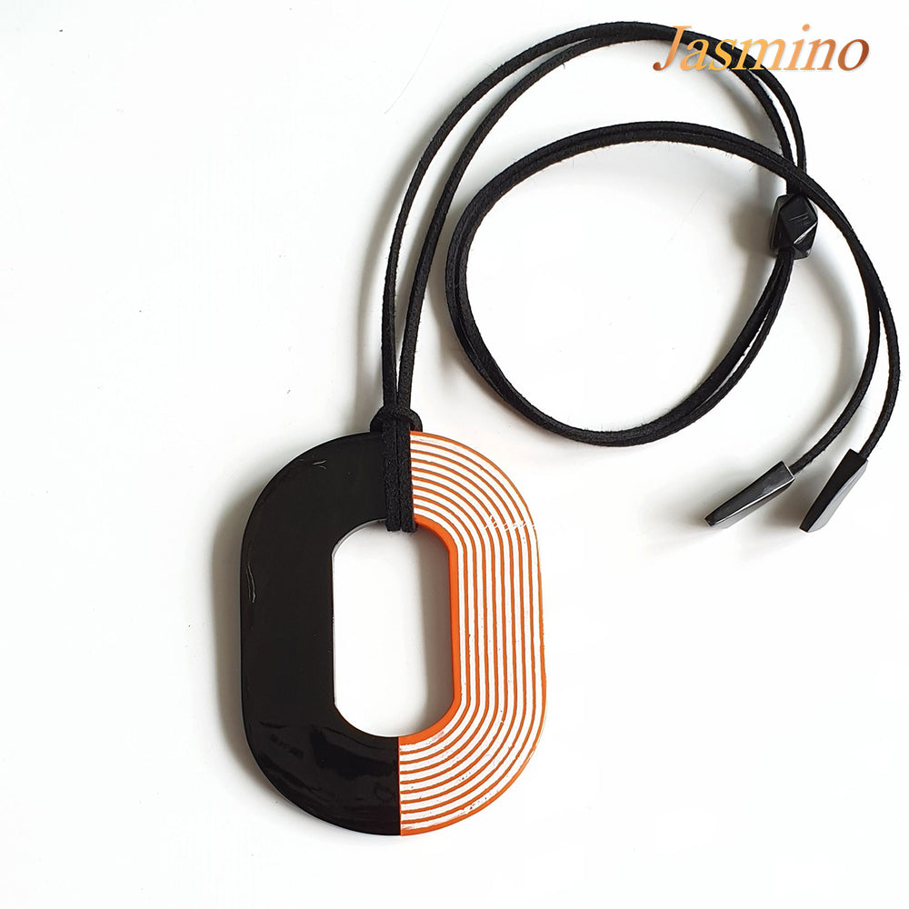 
                  
                    Buffalo horn pendant with half natural horn and half horn painted orange peel with unique brilliant white lines on a light background, impressive gift for her
                  
                
