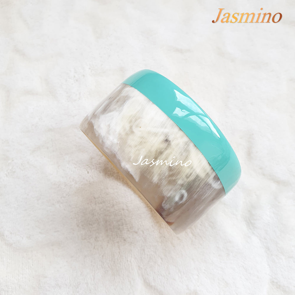 
                  
                    round turquoise lacquer buffalo horn bracelet on the light background, unique gift for her
                  
                